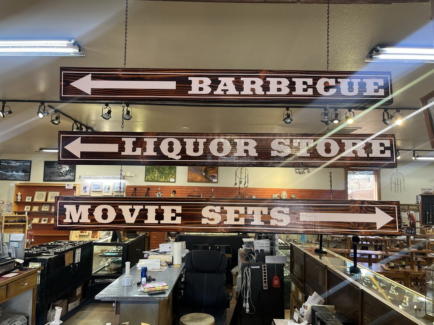 Signs inside Giff's pointing to the barbecue, the liquor store and the movie sets
